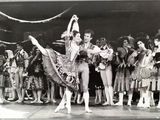 black and white photograph of a couple of dancers performing on stage