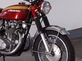 a red and yellow motorcycle parked in a garage
