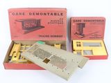 two boxed boxes of train tracks and a remote control device