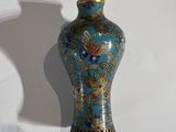 a vase that is sitting on the wall