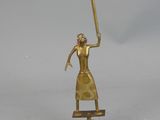 brass figurine of a woman holding a sword on a stand