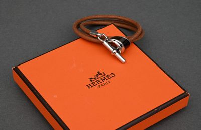 an orange box with a silver lock on a black surface