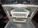 an image of a dishwasher with a basket in it
