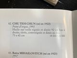 a book open on a table with a picture of a clock