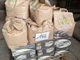 many bags of food sitting on top of a pallet