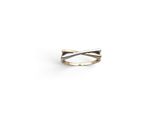 a close up of a silver ring on a white background