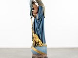 a statue of a woman holding a child on a cart