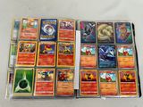 a lot of different pokemon cards on the table