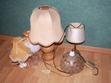a lamp that is sitting on the floor next to a lamp