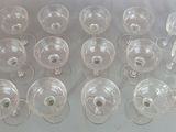 many empty wine glasses sitting on a table