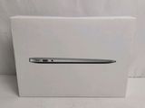 an apple macbook pro is in a box on a white surface