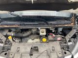 the engine of a car with its hood open and the hood open