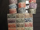 a lot of different stamps on display on the wall