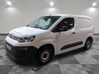 the white van is parked on a checkered tile floor