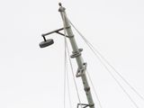 an image of a pole with a clock on it