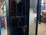 an image of a server cabinet in a warehouse