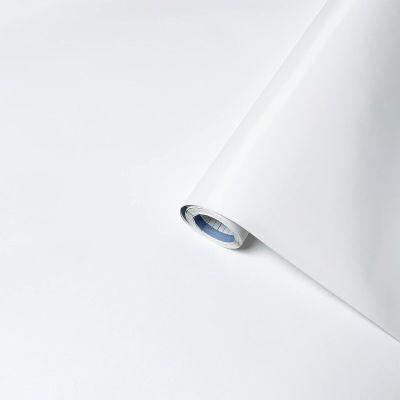 a close up of a roll of white paper on a white surface