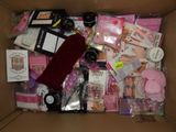a cardboard box filled with lots of items for a girl ' s birthday