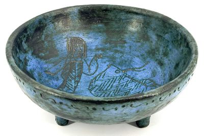 a blue bowl with a picture of a man and a woman on it