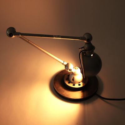 a lamp that is on a table with a cat on it