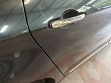 a close up of a door handle on a car