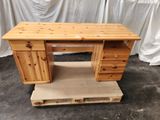 a wooden desk with two drawers and a drawer underneath it
