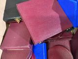 many pieces of luggage in a cardboard box