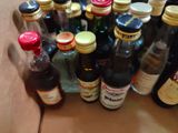many bottles of alcohol sitting in a cardboard box