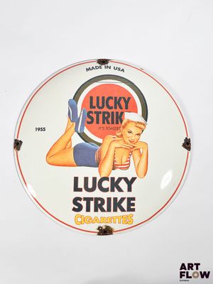 a sign that says lucky strike cigarettes on it