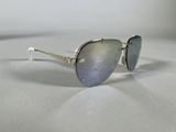 sunglasses on a table with a white surface and a white background