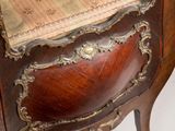 a wooden chair with a cushion on top of it