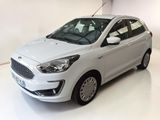 the white car is parked in a white room with a white floor
