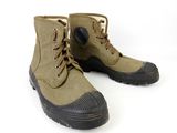 a close up of a pair of military boots on a white background