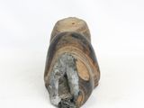 a small piece of wood that is sitting on a white surface