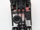 a toy truck that is sitting on a white surface