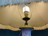 a lamp that is sitting on a table in a room