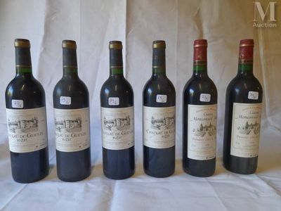 six bottles of wine are lined up in a row on a table
