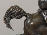 a bronze statue of a horse with a rider on it