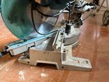 someone is using a circular saw to cut a piece of wood