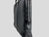 a black briefcase with a checkered pattern on the front