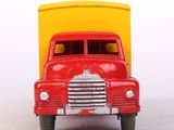 a red toy truck with a yellow box in the back