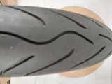 a close up view of a motorcycle tire on the ground