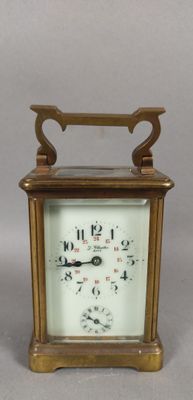 a small clock that is sitting on a table