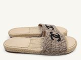 women ' s slippers with a monogram logo on the side