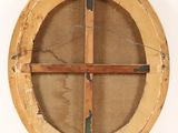 an old wooden circular window with a wooden frame on the outside