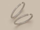 a pair of diamond hoop earrings