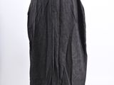 a black dress on a mannequin stand against a white background