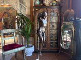 a statue of a man on a cross in a room