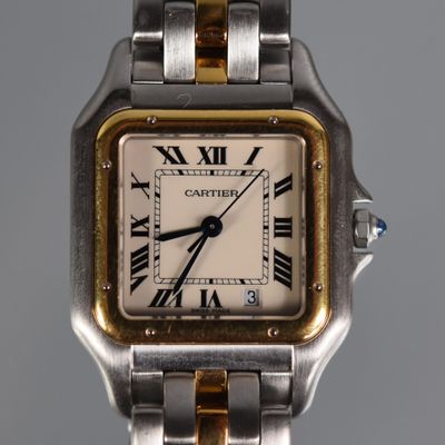 an image of a close up of a wrist watch with roman numerals