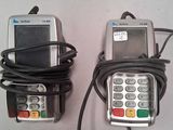 two cell phones that are connected to a charger